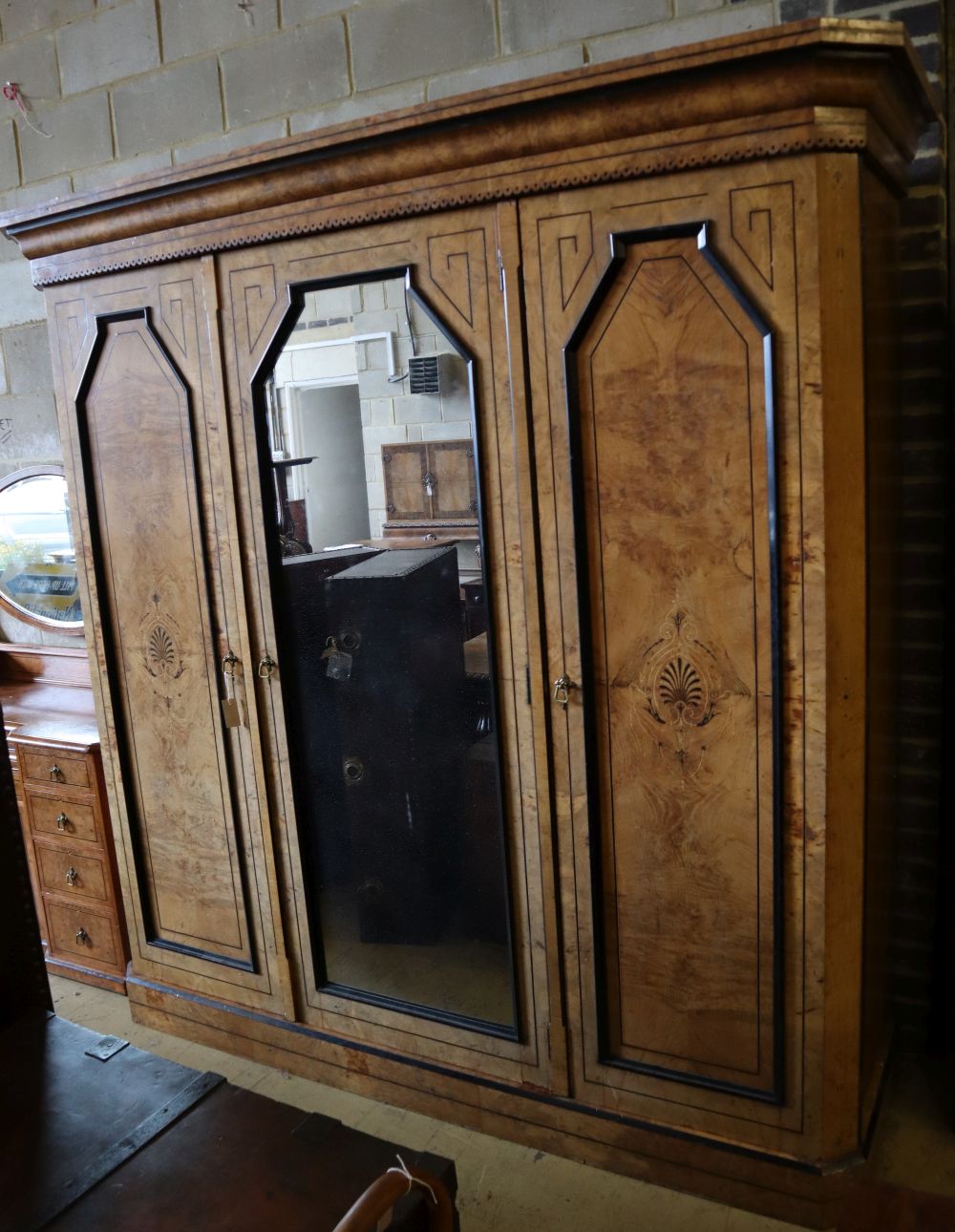 A late Victorian inlaid burr oak triple wardrobe, width 220cm depth 68cm height 221cm